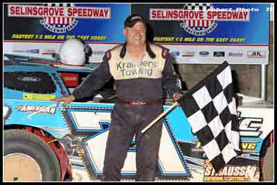 Scott Haus celebrating in victory lane at Selinsgrove Speedway